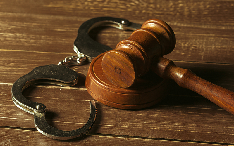 Close-up view of brown wooden mallet of judge